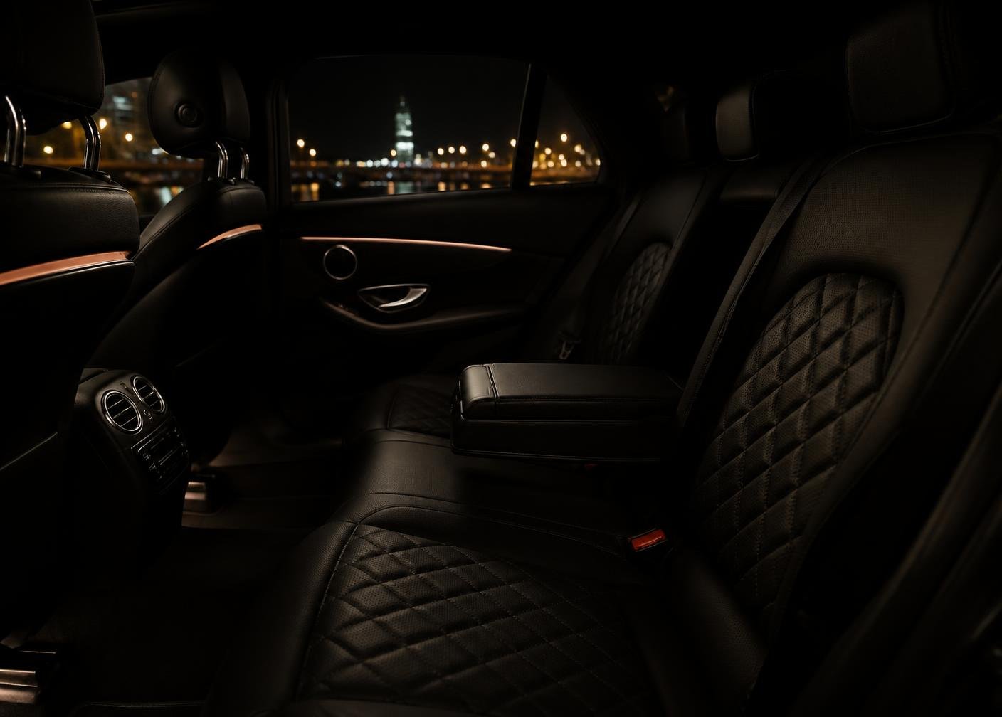 Interior of a chauffeured black car at night in Manhattan